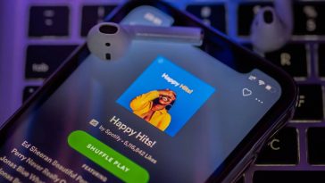 Spotify botão play shuffle álbuns