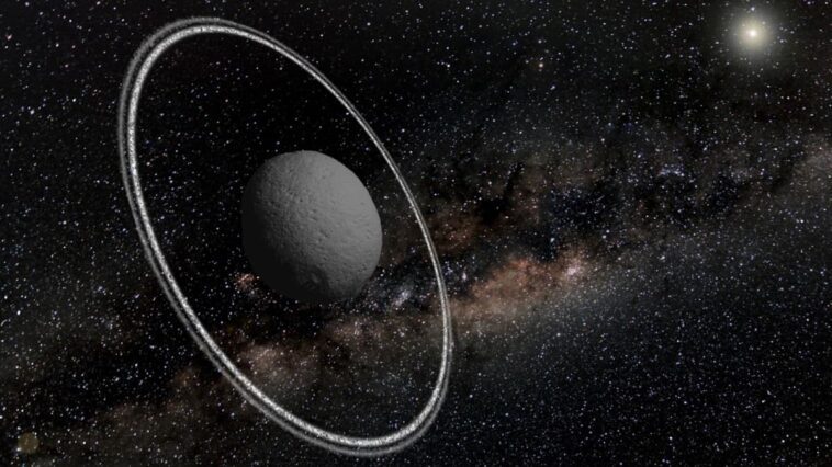 Ilustração do asteroide Chariklo com os anéis de água descobertos pelo Telescópio James Webb