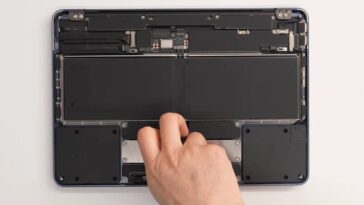 Inside MacBook Neo shows a little computer and a lot of battery, speakers, and trackpad